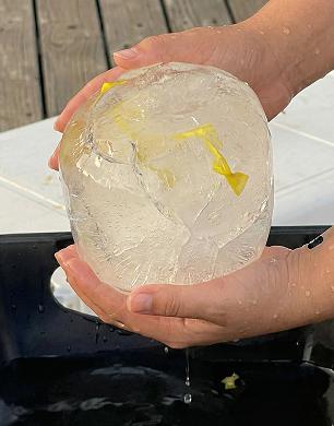 Frozen message escape room puzzle - ice ball with hidden clue inside